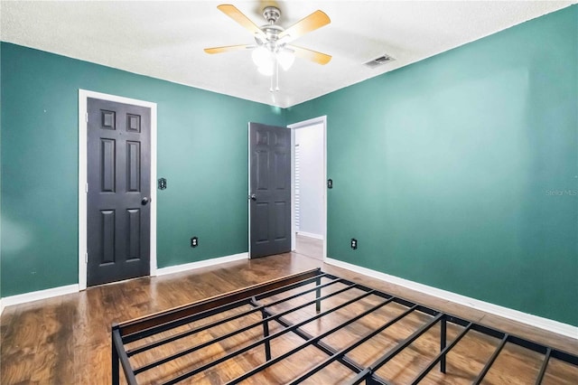 bedroom featuring wood-type flooring and ceiling fan