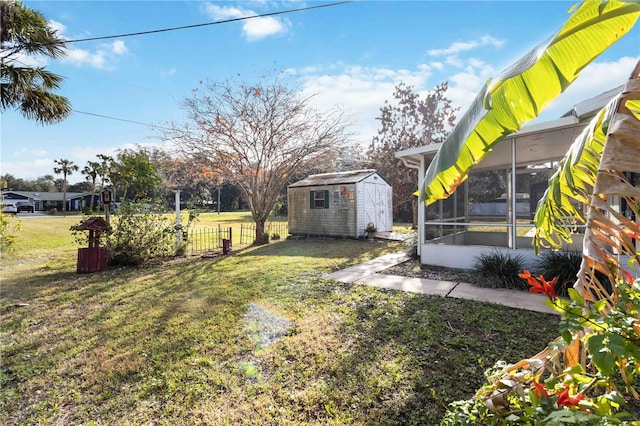 view of yard featuring a storage unit and a sunroom