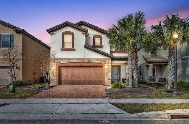 mediterranean / spanish-style house featuring a garage