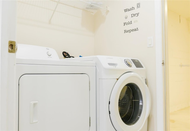 washroom with washing machine and dryer