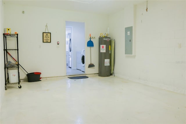 garage with water heater, washer / clothes dryer, electric panel, and white refrigerator