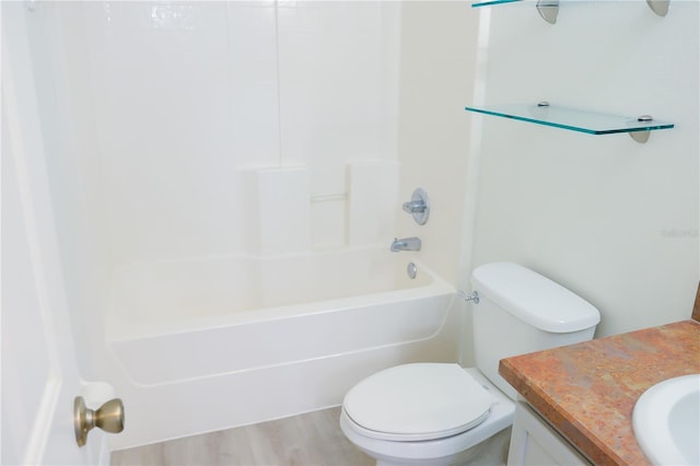 full bathroom with wood-type flooring, shower / bathing tub combination, vanity, and toilet