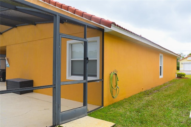 view of side of property with a yard