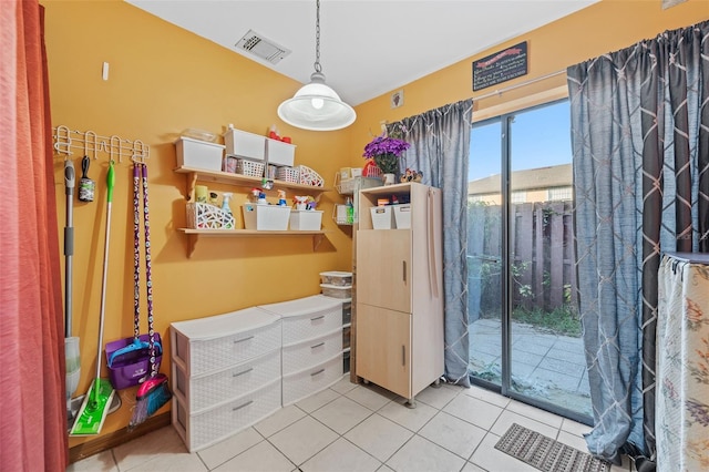 interior space with visible vents and tile patterned floors