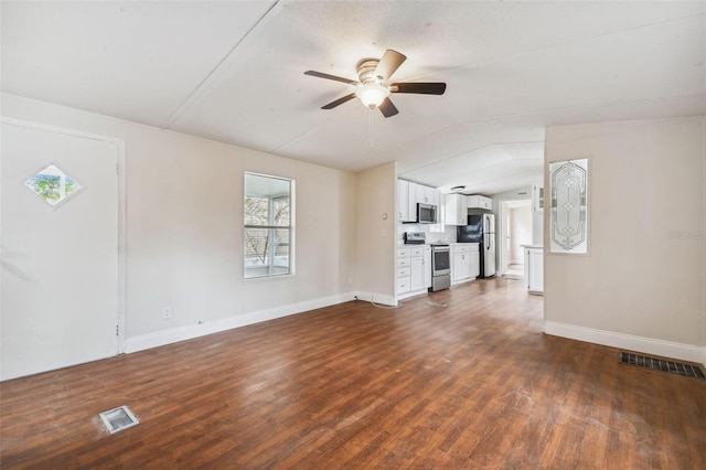 unfurnished living room with dark hardwood / wood-style flooring and ceiling fan