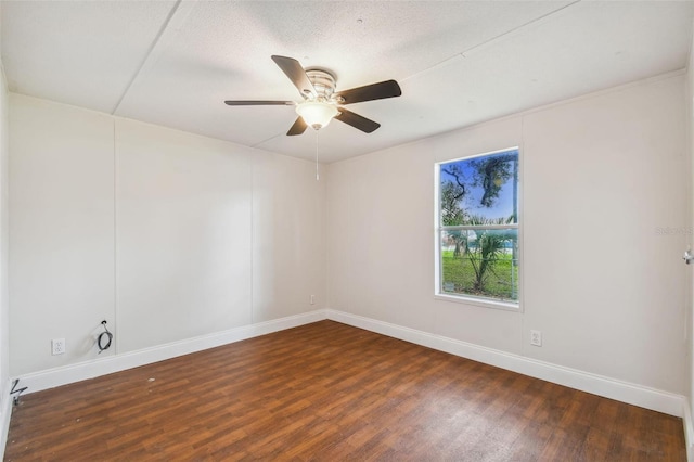 4611 Gall Blvd, Zephyrhills, FL 33542 - empty room with a ceiling fan, wood finished floors, and baseboards