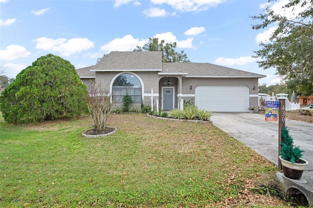 ranch-style home with a front lawn and a garage