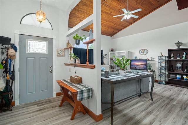 foyer featuring high vaulted ceiling, ceiling fan, light wood-type flooring, plenty of natural light, and wood ceiling