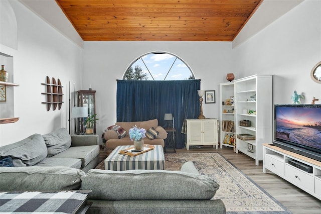 living room featuring hardwood / wood-style floors, high vaulted ceiling, and wood ceiling