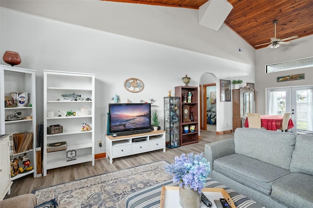 living room with ceiling fan, french doors, wooden ceiling, high vaulted ceiling, and light hardwood / wood-style floors