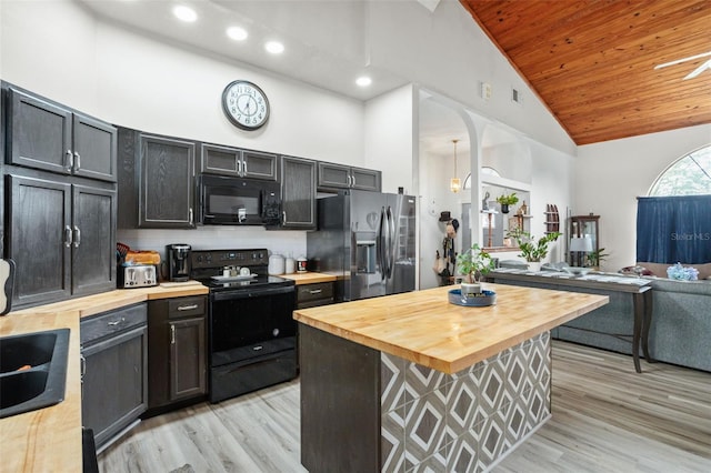 kitchen featuring wooden ceiling, high vaulted ceiling, butcher block countertops, decorative backsplash, and black appliances