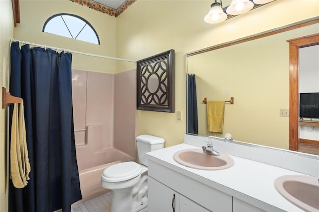 full bathroom with toilet, vanity, and shower / tub combo with curtain