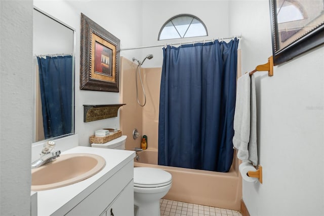 full bathroom featuring tile patterned floors, vanity, shower / bath combination with curtain, and toilet