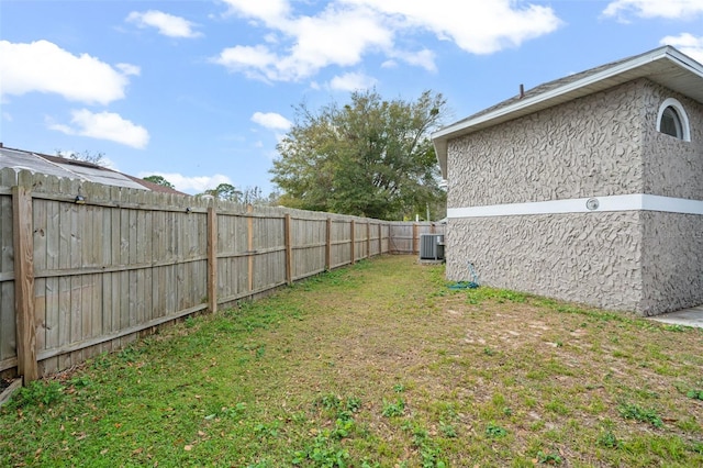 view of yard with central AC