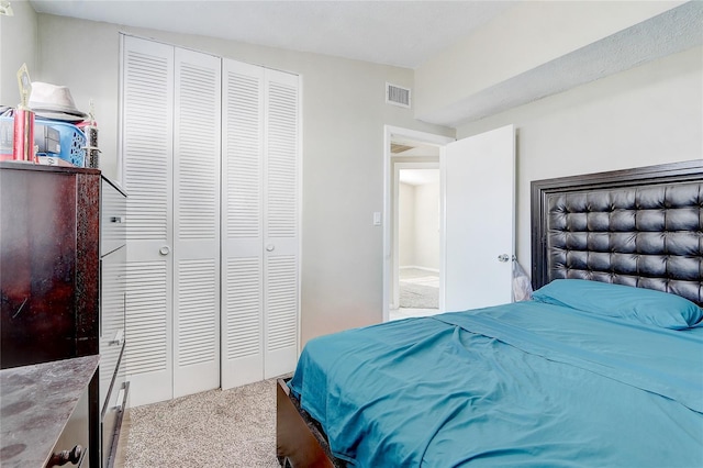 carpeted bedroom featuring a closet