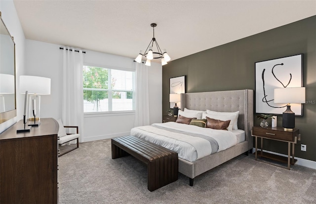 bedroom featuring light colored carpet and a chandelier