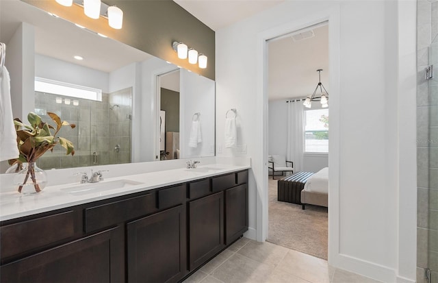 bathroom with tile patterned floors, vanity, and walk in shower