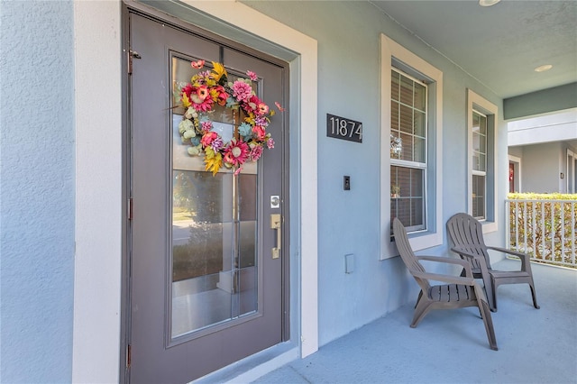 entrance to property with a porch