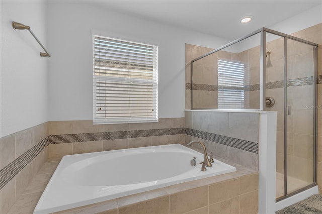 bathroom with shower with separate bathtub