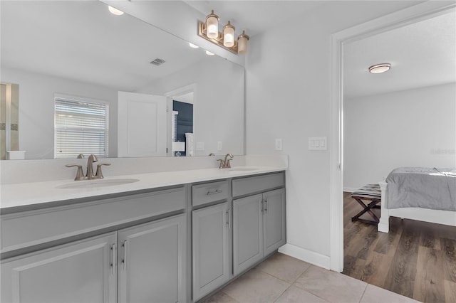 bathroom featuring tile patterned flooring and vanity