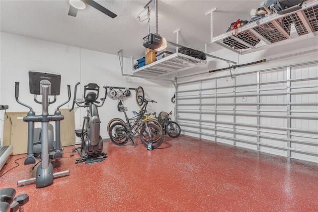 garage with ceiling fan and a garage door opener