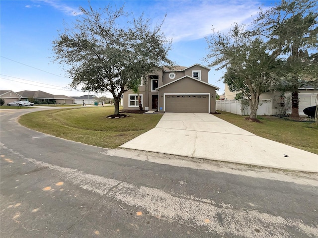 view of front of property featuring a garage and a front yard