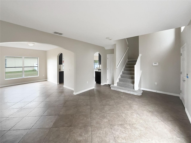 unfurnished living room featuring tile patterned floors