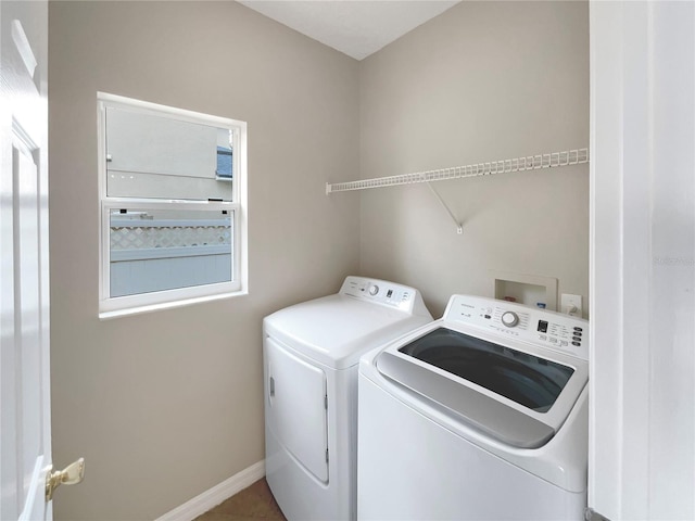 laundry room with independent washer and dryer