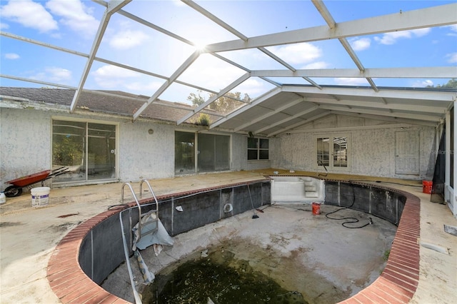 view of patio / terrace featuring glass enclosure