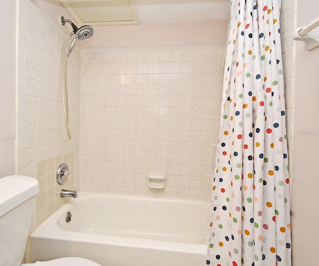 bathroom featuring toilet and shower / bathtub combination with curtain