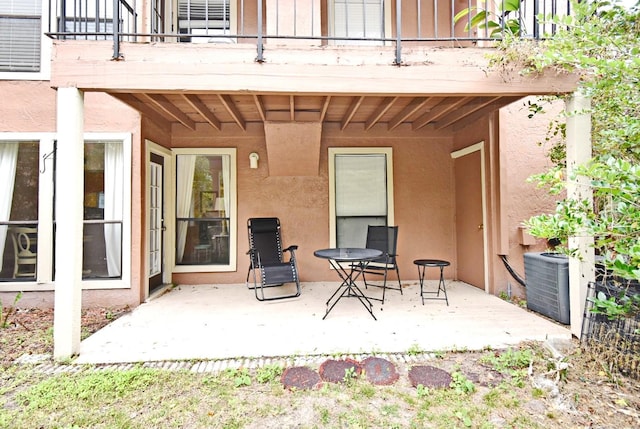 view of patio / terrace featuring central air condition unit and a balcony