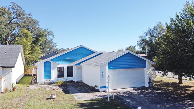 single story home featuring a garage