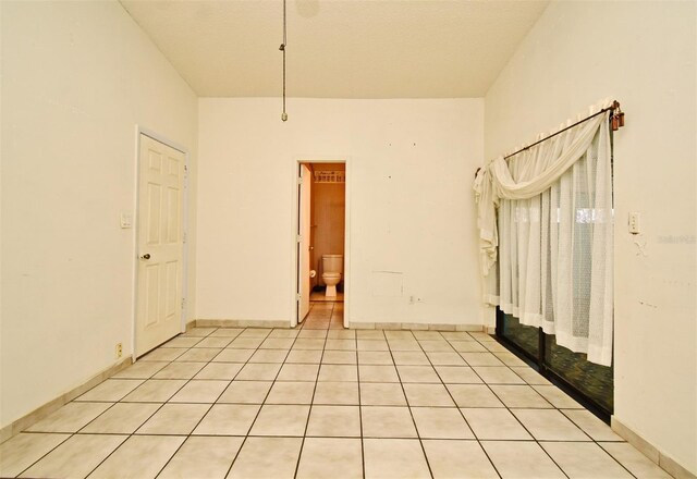 empty room featuring light tile patterned floors