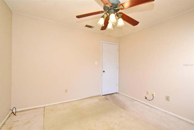 unfurnished room featuring ceiling fan and light carpet