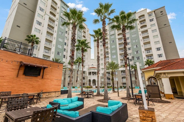 view of building exterior featuring a community pool