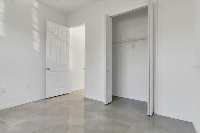 unfurnished bedroom with a closet