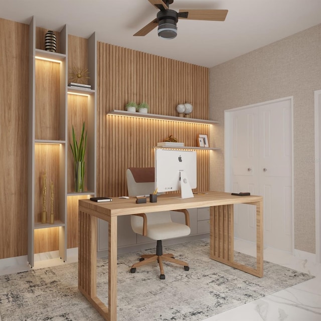 home office featuring ceiling fan and built in desk