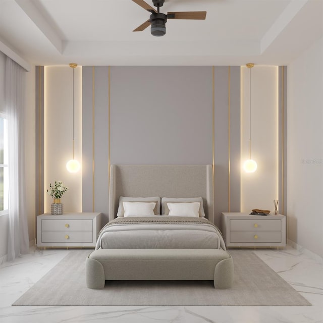 bedroom with a tray ceiling and ceiling fan