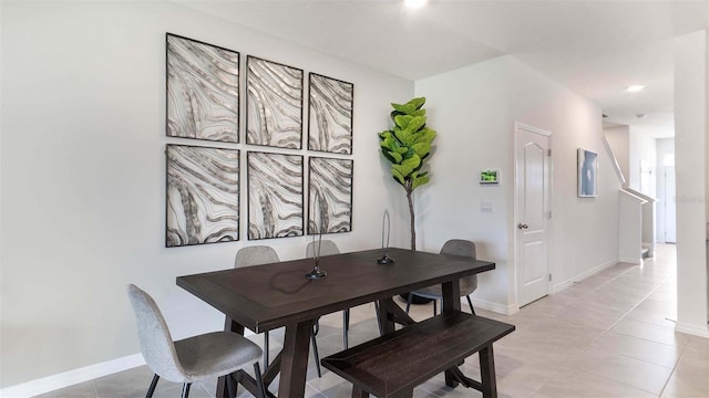 dining space with light tile patterned floors