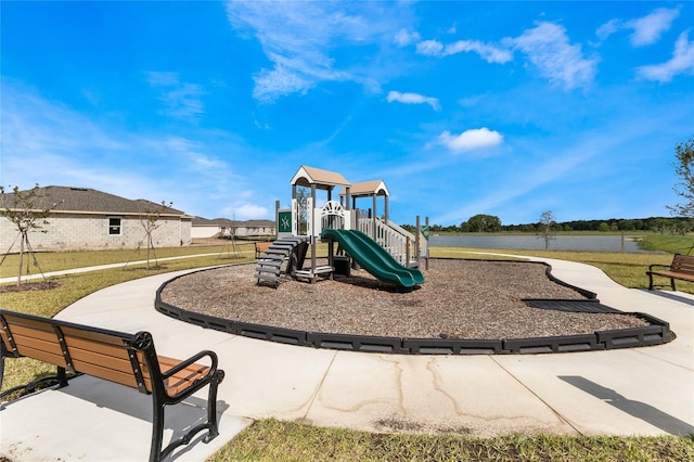 view of playground with a lawn