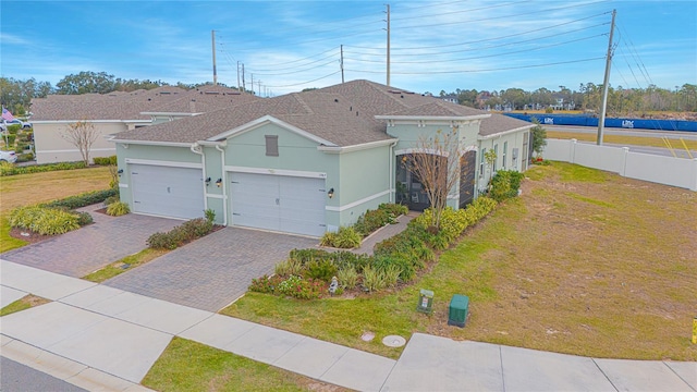 1987 Key Bay Trl, Kissimmee, FL 34747 - view of front of property with driveway, a garage, stucco siding, and a shingled roof