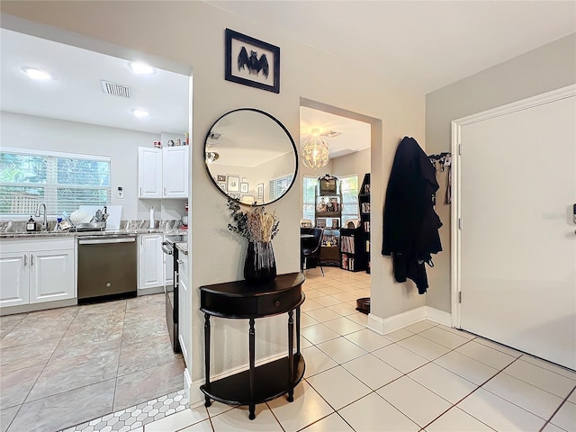 interior space featuring sink and light tile patterned floors