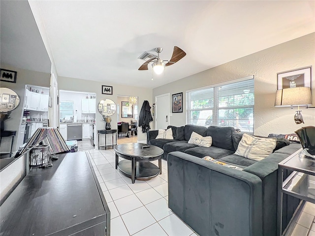 living room with ceiling fan and light tile patterned floors