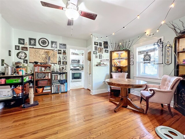 dining space featuring hardwood / wood-style floors and ceiling fan