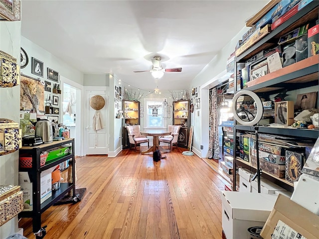 miscellaneous room featuring hardwood / wood-style flooring and ceiling fan