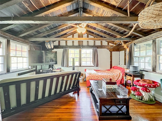 bedroom with hardwood / wood-style flooring, vaulted ceiling with beams, and wooden ceiling