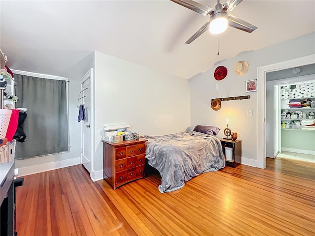 bedroom featuring ceiling fan and wood-type flooring