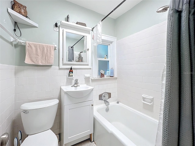 full bathroom with shower / bath combo, vanity, and toilet