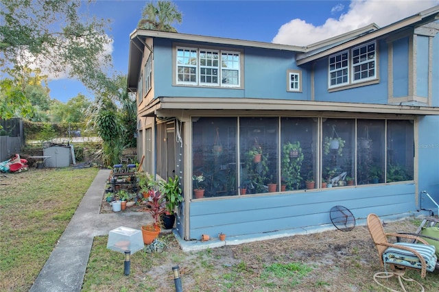 exterior space featuring a sunroom