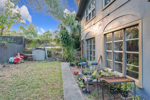 view of yard with a storage unit